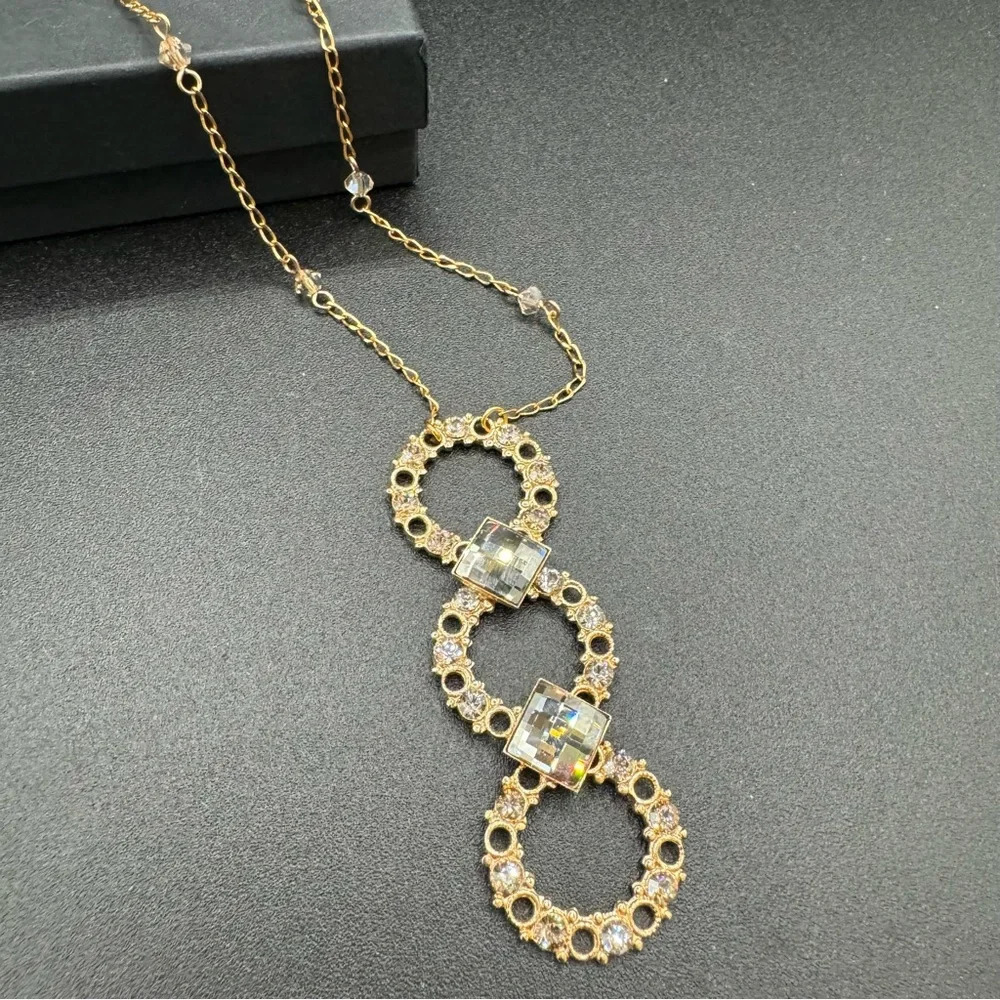 Vintage Belladonna Circular Crystal and Gold Tone Infinity Pendant Necklace